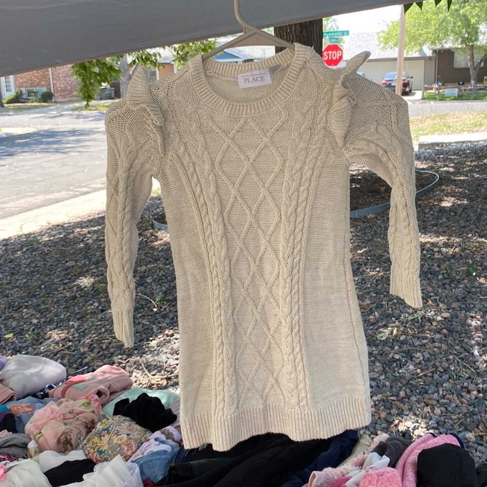 A Dress with pecks of gold and beige color
